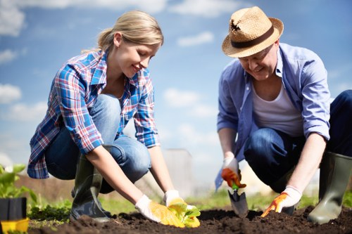 Gardening team preparing a garden service booking terms document